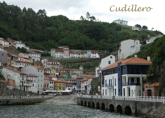 Cudillero, arriving from the sea. - Click here to see the vertical houses on cliffs.